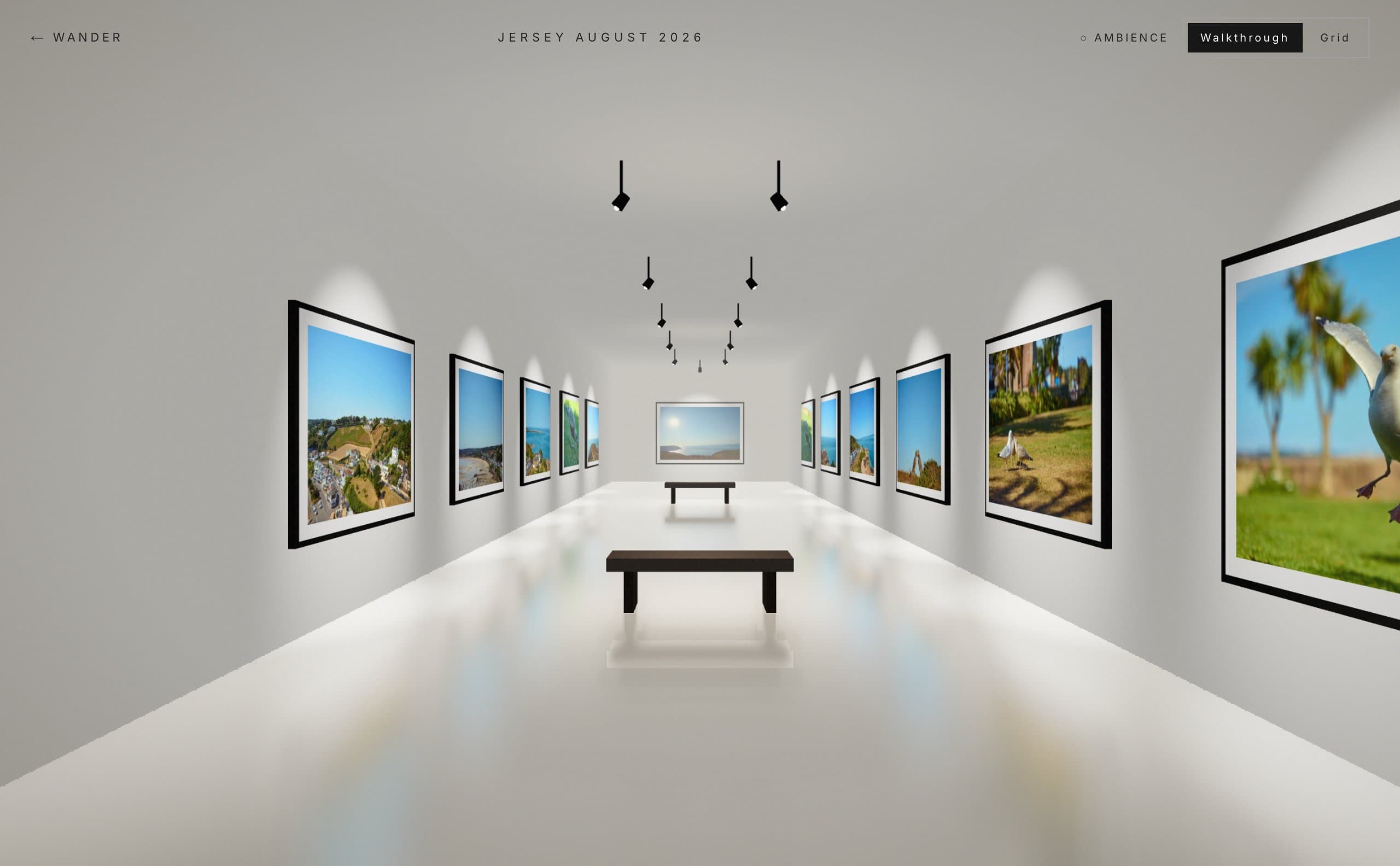 The Jersey August 2026 collection as a 3D gallery: a white room with framed photos of Jersey along both walls, a spotlight above each one and benches down the middle.